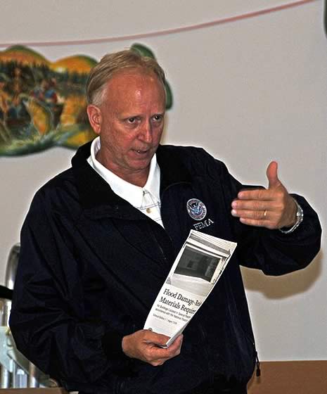 On November 15, 2008, National Flood Insurance Program (NFIP) Lead Wayne Berggren outlined the NFIP program and explained helpful resources available to residents affected by flooding at a community meeting on Flood Proofing and Elevation Information in Jean Lafitte, Louisiana.